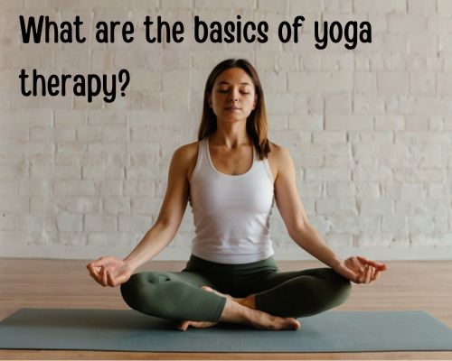 a woman doing basic yoga therapy in a studio